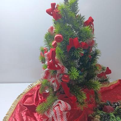 Faux Christmas tree with ornaments and bows - tree skirt and Plastic greenery