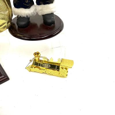 556 Gold and Navy Santa Figures