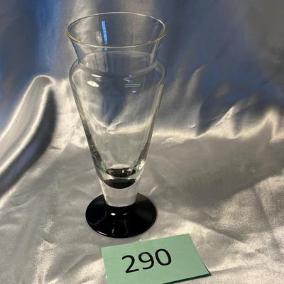 Crystal vase with black foot.