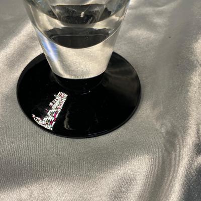 Crystal vase with black foot.