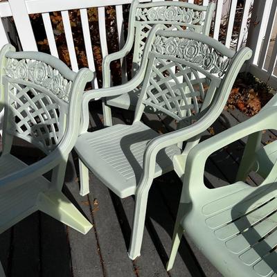 5 Green Plastic Stacking Chairs