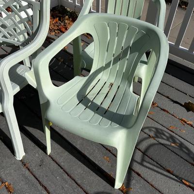 5 Green Plastic Stacking Chairs