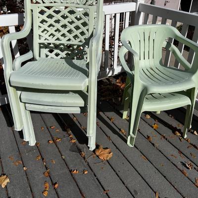 5 Green Plastic Stacking Chairs