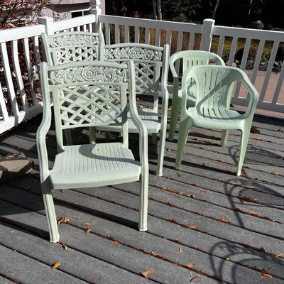 5 Green Plastic Stacking Chairs
