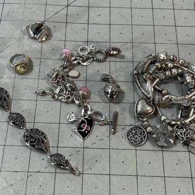 Pile of Lia SOPHIA Rings, Pendants and Bracelets