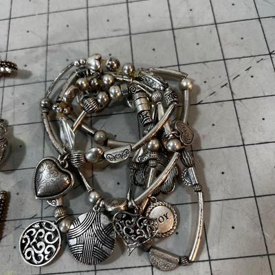 Pile of Lia SOPHIA Rings, Pendants and Bracelets