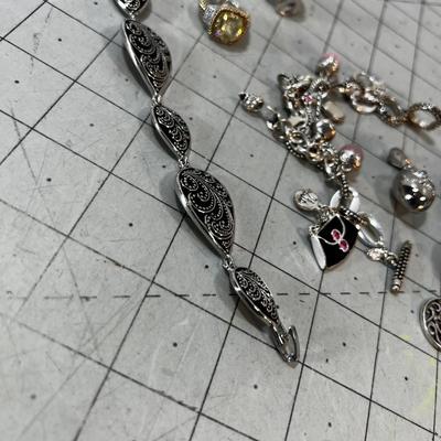 Pile of Lia SOPHIA Rings, Pendants and Bracelets