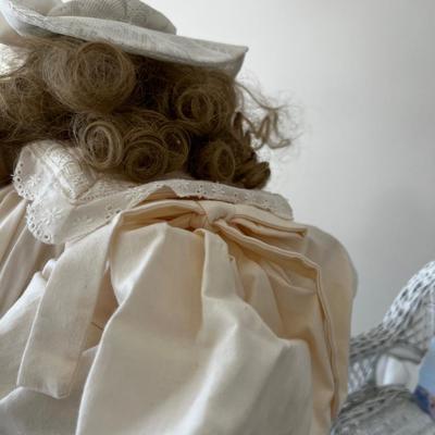 Beautiful Buttercup Porcelain Doll In Wicker Chair. 