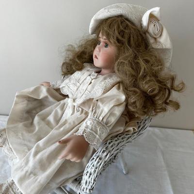 Beautiful Buttercup Porcelain Doll In Wicker Chair. 