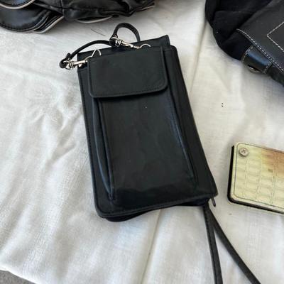 Small Pile of Black Purses 