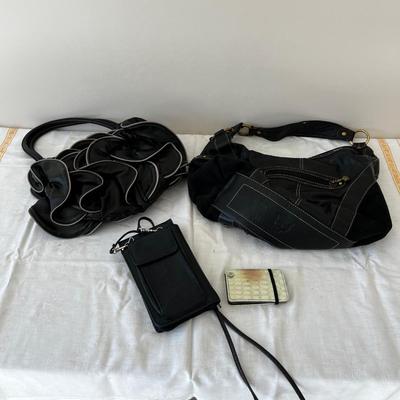 Small Pile of Black Purses 