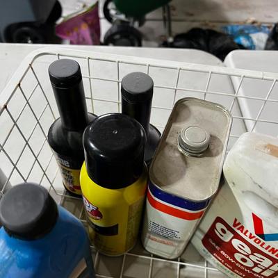 Garage Tray Full of Automotive Fluids, Many opened but some not.