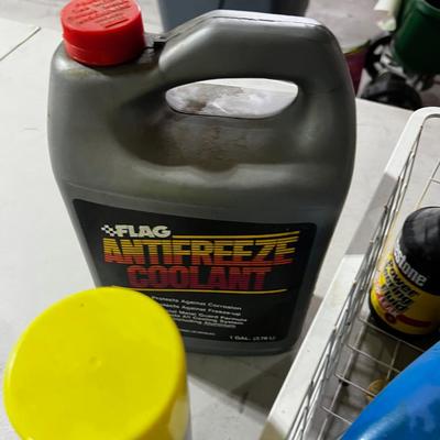Garage Tray Full of Automotive Fluids, Many opened but some not.