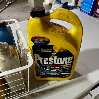 Garage Tray Full of Automotive Fluids, Many opened but some not.