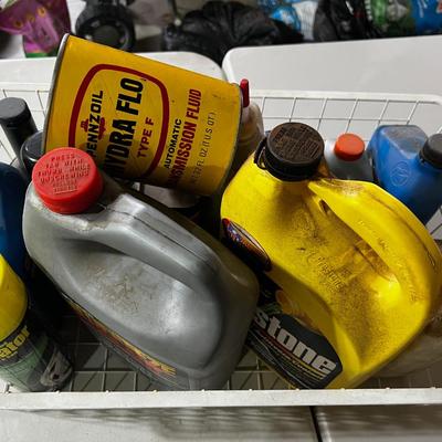 Garage Tray Full of Automotive Fluids, Many opened but some not.