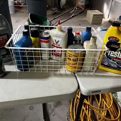 Garage Tray Full of Automotive Fluids, Many opened but some not.