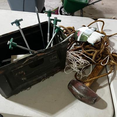 Garage: Tent Pegs ,,Rope and a Hammer in an old AMMO Box