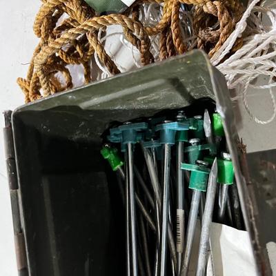 Garage: Tent Pegs ,,Rope and a Hammer in an old AMMO Box