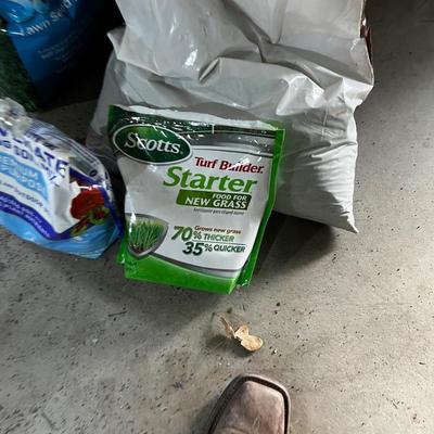 Garage: Potting Soil and Grass Seed - Partial Bags. Opened