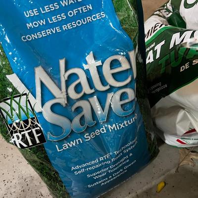 Garage: Potting Soil and Grass Seed - Partial Bags. Opened