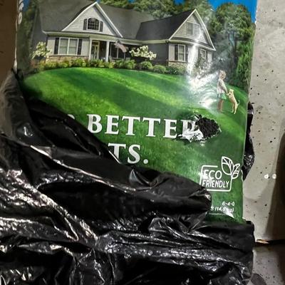 Garage Bag of Milo Nitrogen Fertilizer, Not opened but has a hole in it.