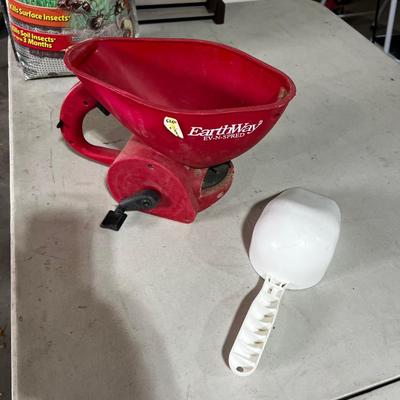 Garage Earthway Fertilizer Spreader and scoop