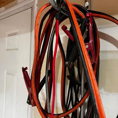 Garage Jumper Cable, Wire, Extension Cords (2 Piles Hanging up) 