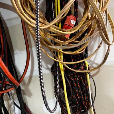 Garage Jumper Cable, Wire, Extension Cords (2 Piles Hanging up) 