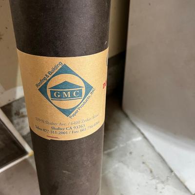 Garage ROLL OF ROOFING TAR PAPER. 