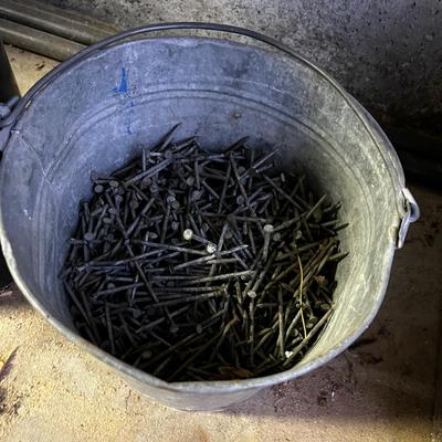 Bucket full of 8 penny Nails 