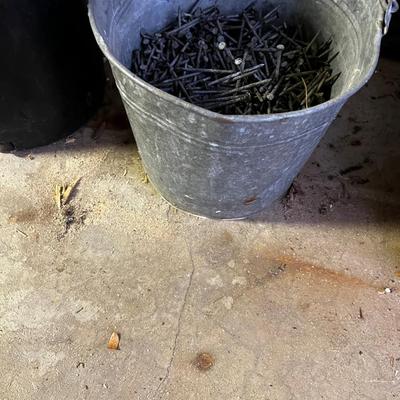 Bucket full of 8 penny Nails 