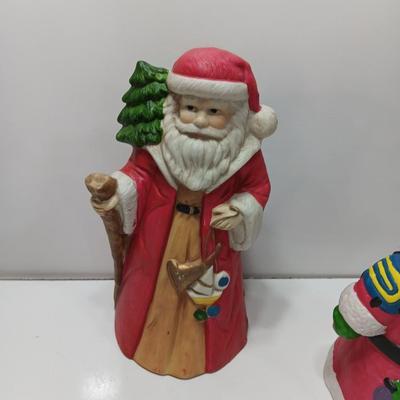 Two ceramic Santa's - candle holder and figure