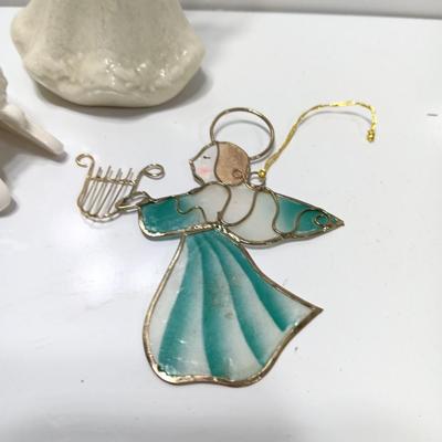 Porcelain angel with white and gold sleigh and blue angel with harp ornament