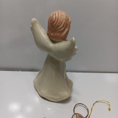 Porcelain angel with white and gold sleigh and blue angel with harp ornament