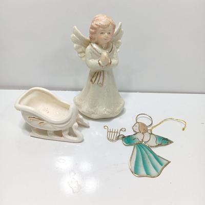 Porcelain angel with white and gold sleigh and blue angel with harp ornament