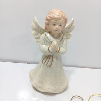 Porcelain angel with white and gold sleigh and blue angel with harp ornament