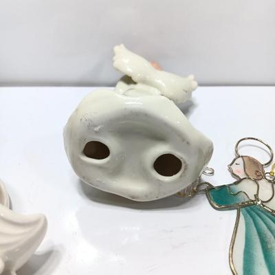Porcelain angel with white and gold sleigh and blue angel with harp ornament