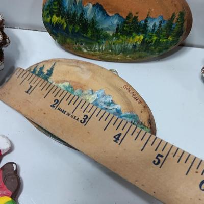 Two hand painted Colorado scenery ornaments on wood and two other Christmas ornaments with pine cones