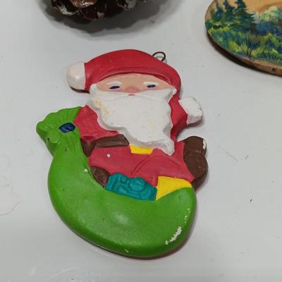Two hand painted Colorado scenery ornaments on wood and two other Christmas ornaments with pine cones