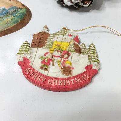 Two hand painted Colorado scenery ornaments on wood and two other Christmas ornaments with pine cones