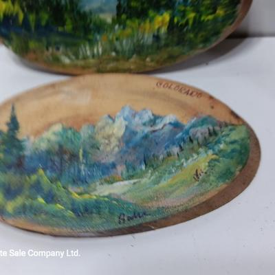 Two hand painted Colorado scenery ornaments on wood and two other Christmas ornaments with pine cones