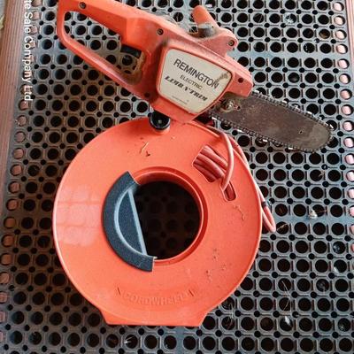 Small Remington Electric Limb n' Trim 8" chain saw with extension cord in cord spool