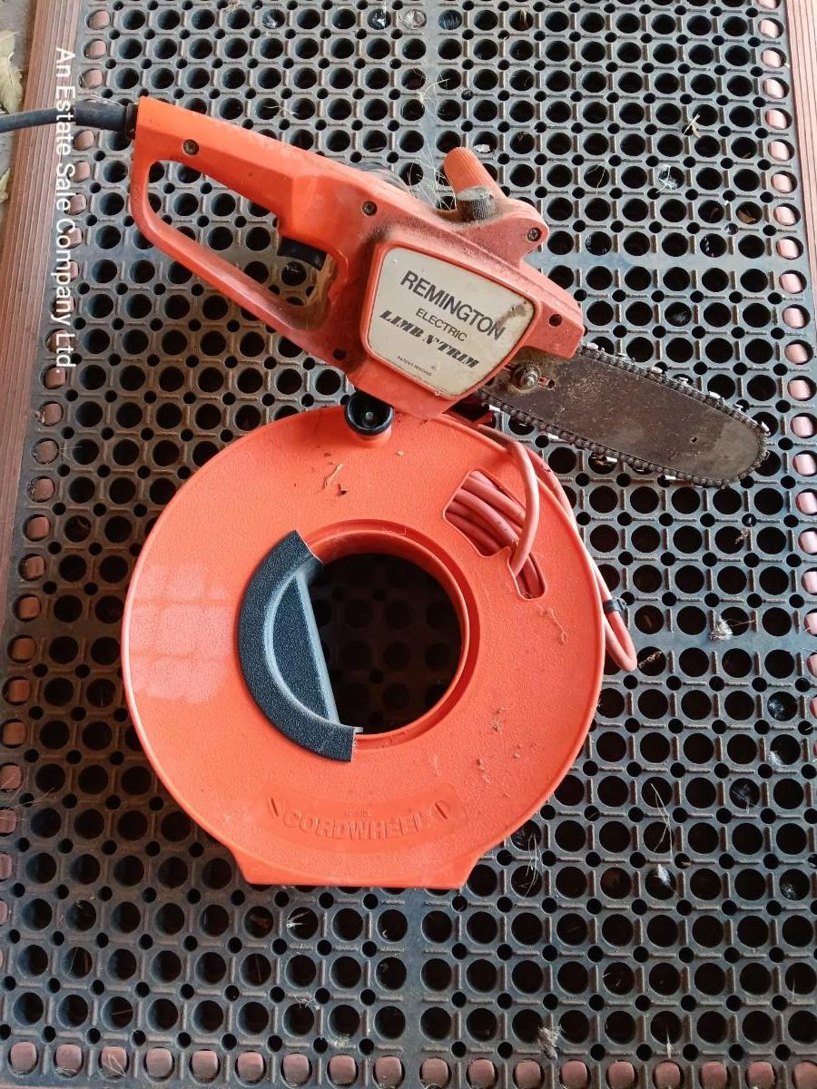 Small Remington Electric Limb n' Trim chain saw with extension cord in cord  spool | EstateSales.org