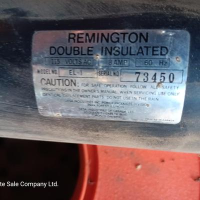 Small Remington Electric Limb n' Trim 8" chain saw with extension cord in cord spool