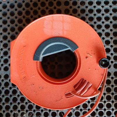 Small Remington Electric Limb n' Trim 8" chain saw with extension cord in cord spool