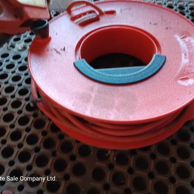 Small Remington Electric Limb n' Trim 8" chain saw with extension cord in cord spool