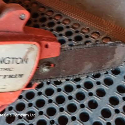 Small Remington Electric Limb n' Trim 8" chain saw with extension cord in cord spool