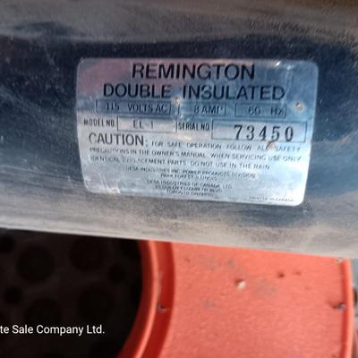 Small Remington Electric Limb n' Trim 8" chain saw with extension cord in cord spool