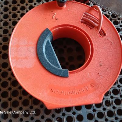 Small Remington Electric Limb n' Trim 8" chain saw with extension cord in cord spool