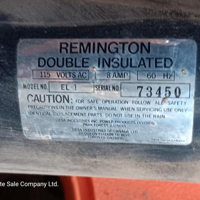 Small Remington Electric Limb n' Trim 8" chain saw with extension cord in cord spool